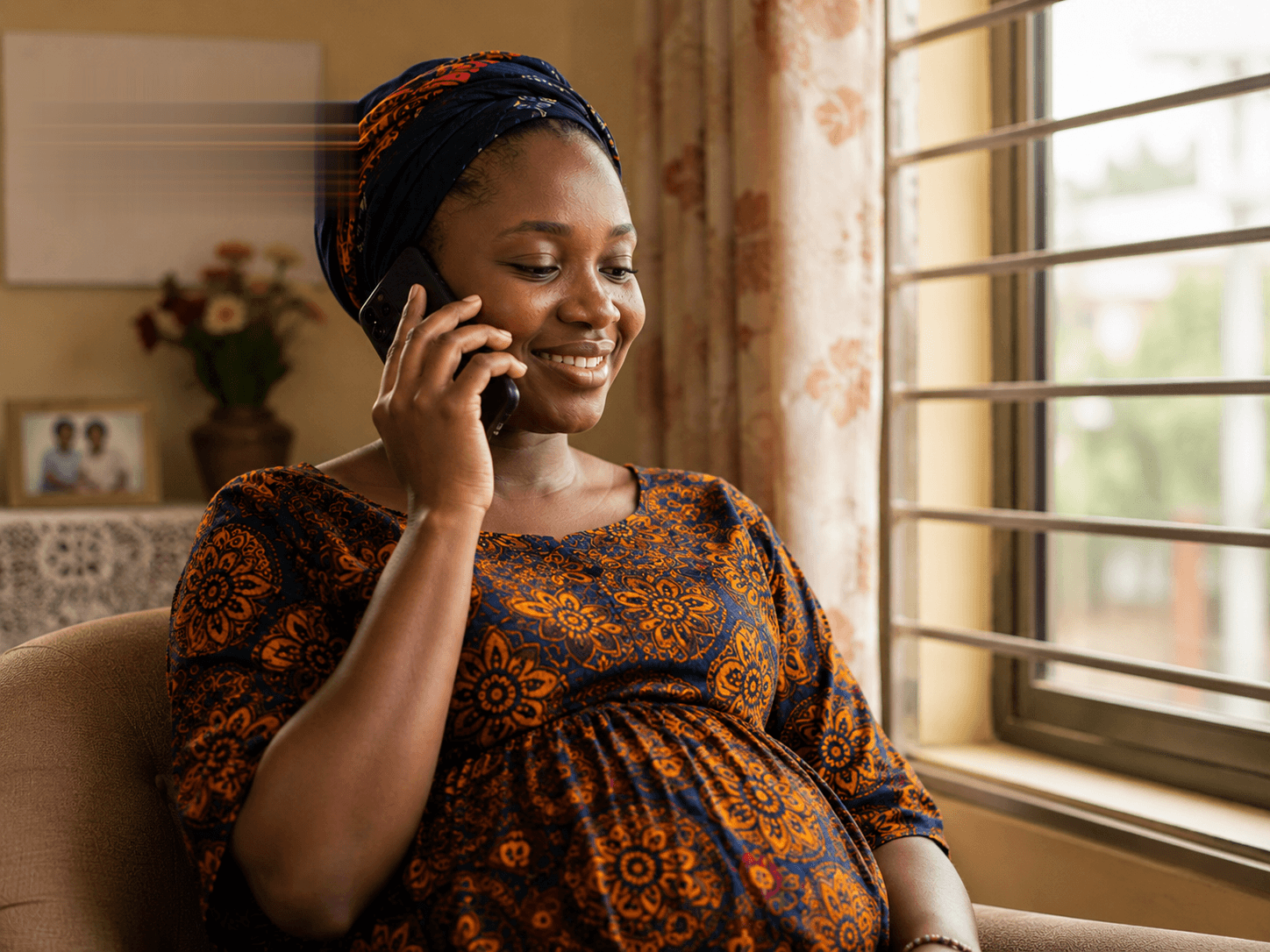 A mother taking an Omaya care call at home
