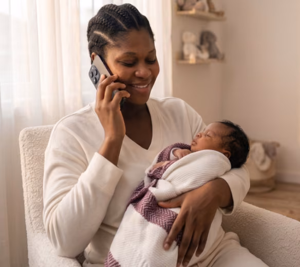 Mother on phone with baby